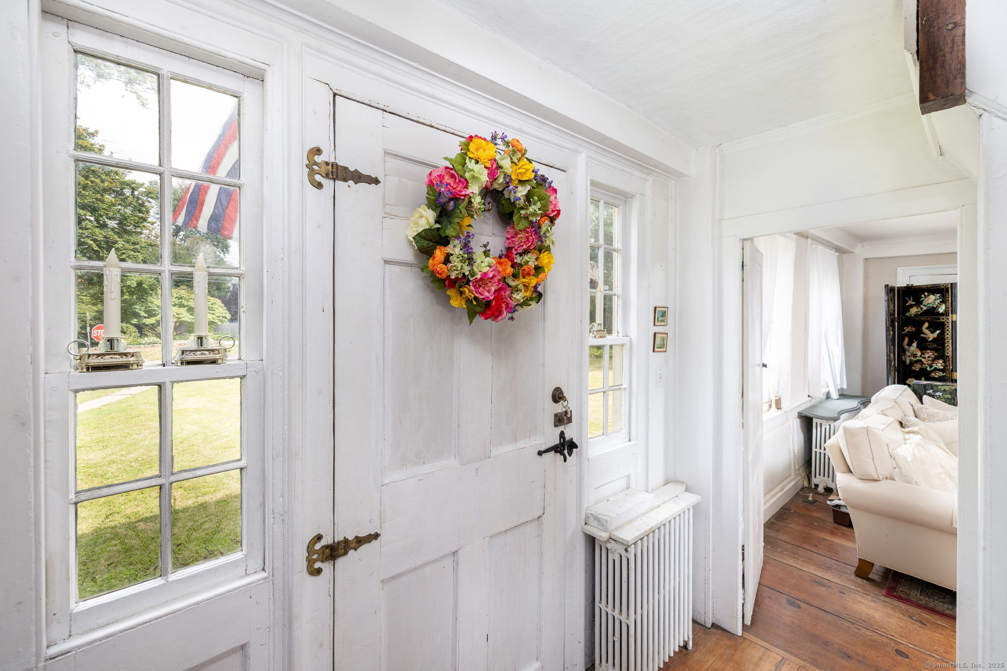 493 Main Street Wethersfield, CT 06109 - Photo 33 of 40 a very nice looking room with a big window and wooden floor