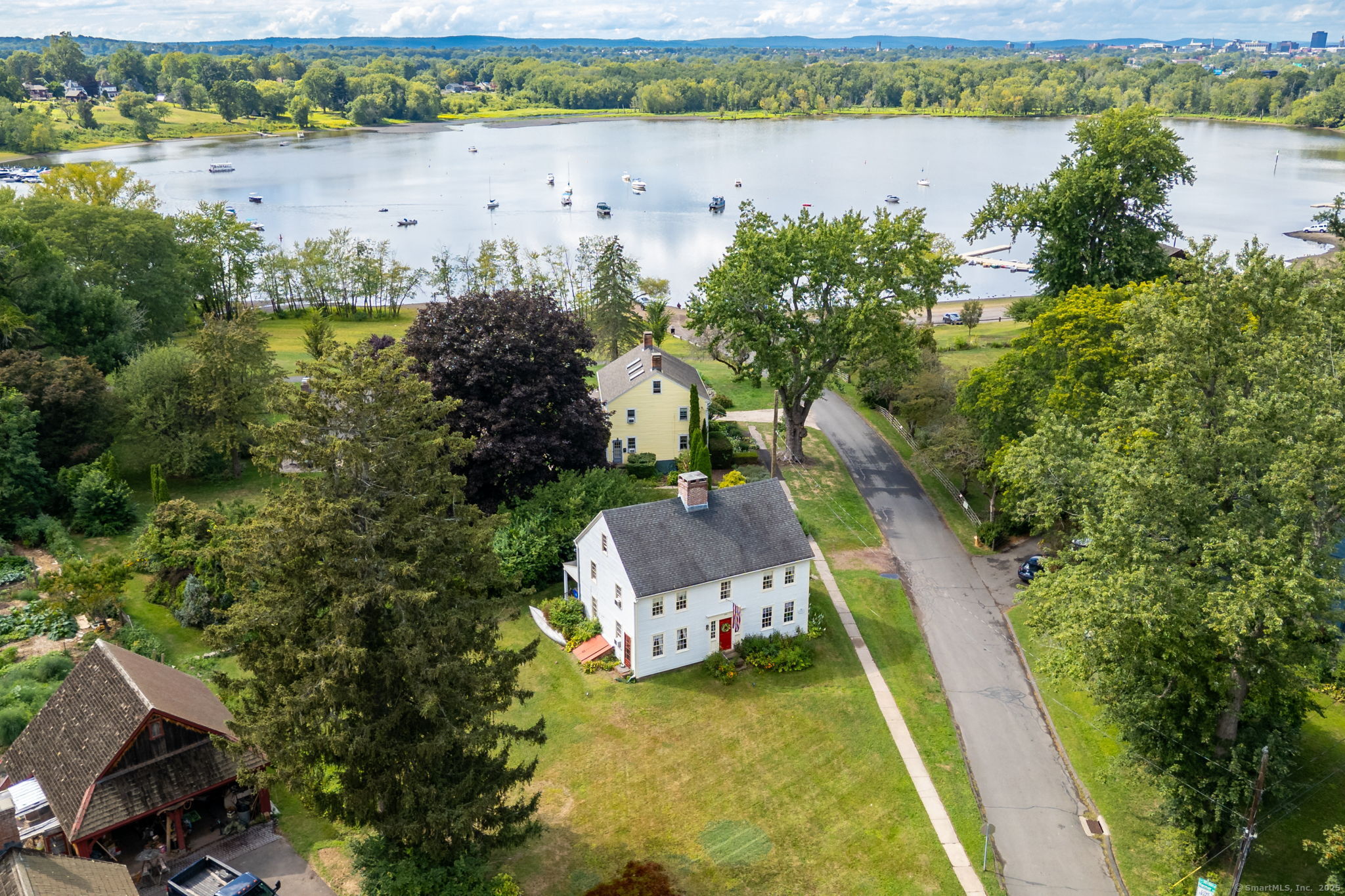 493 Main Street Wethersfield, CT 06109 - Photo 5 of 40 an aerial view of a house with a lake view