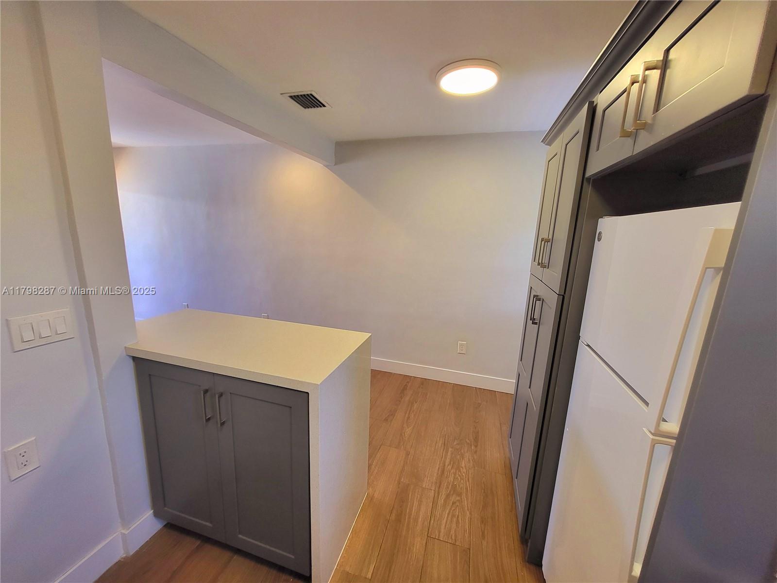2355 Southwest 27th Street, Unit 4 Miami, FL 33133 - Photo 17 of 25 a view of hallway with wooden floor