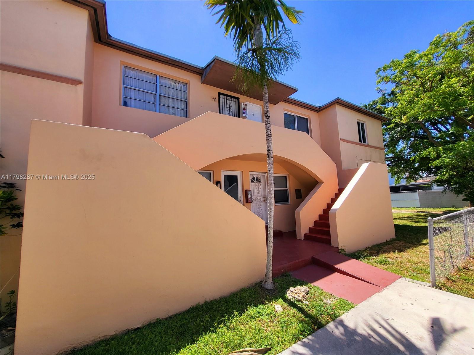 2355 Southwest 27th Street, Unit 4 Miami, FL 33133 - Photo 25 of 25 a front view of a house with a yard
