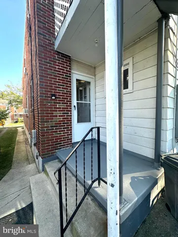a view of balcony with wooden floor and fence