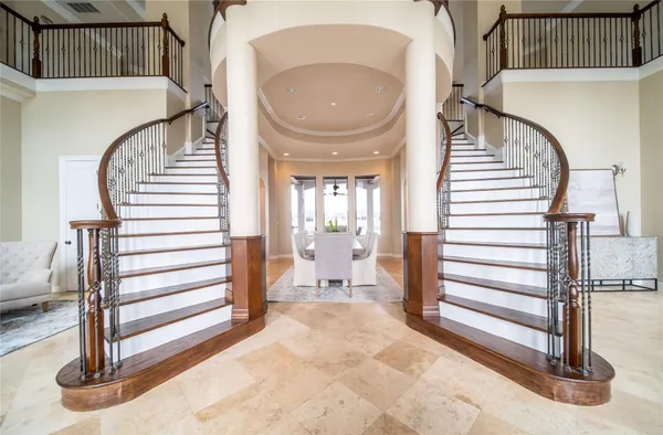 a view of a hallway with entryway wooden floor and front door