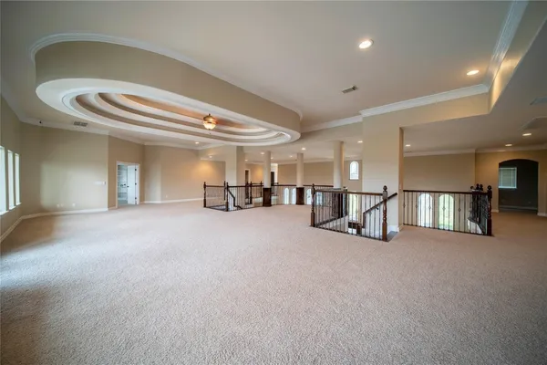 a view of a livingroom with furniture and a ceiling fan