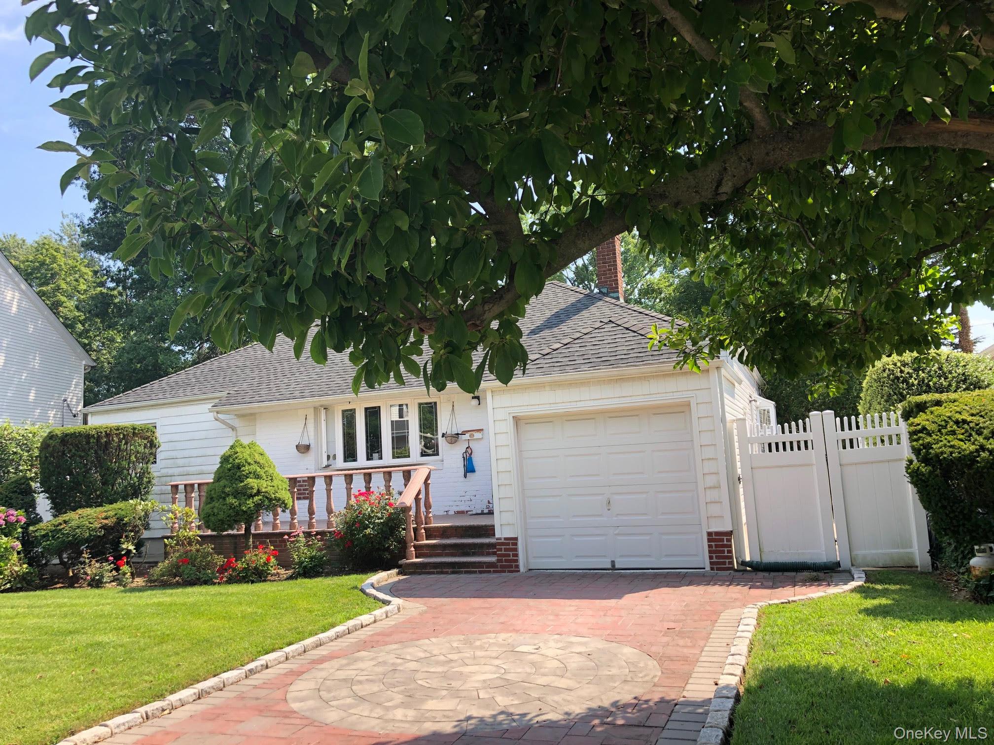 69 Soundview Road Great Neck, NY 11020 - Photo 2 of 8 a view of house with yard and green space