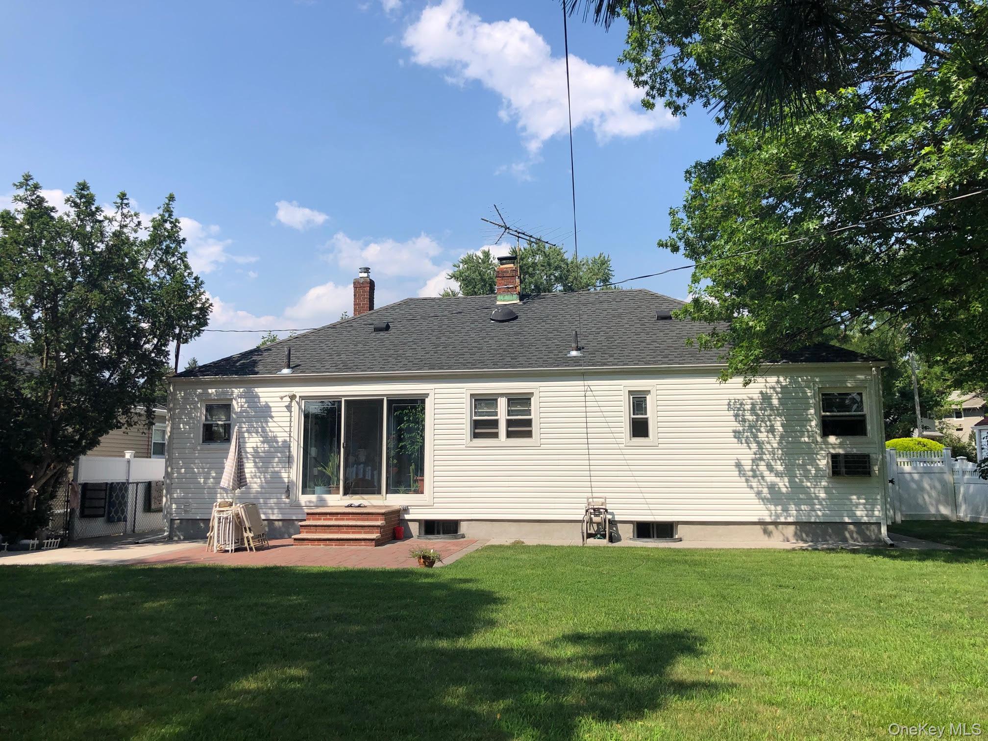 69 Soundview Road Great Neck, NY 11020 - Photo 7 of 8 a front view of house with yard