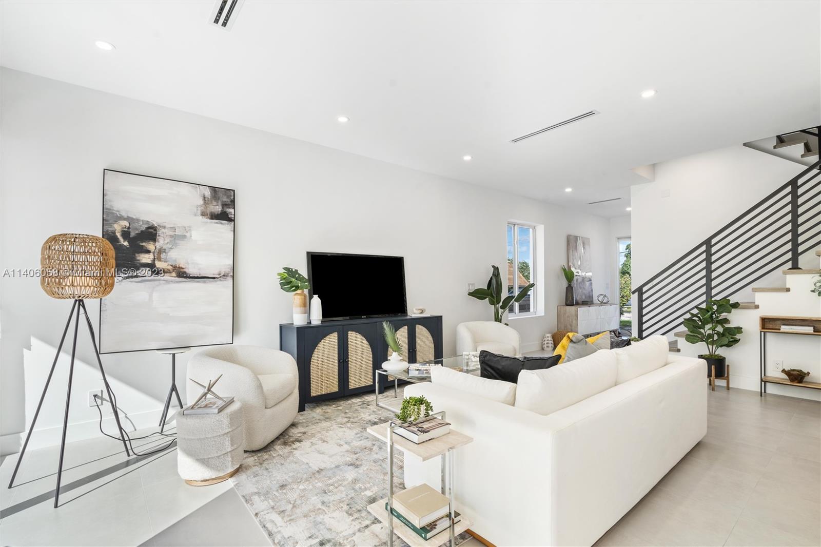 2290 Southeast 6th Street Pompano Beach, FL 33062 - Photo 11 of 22 a living room with furniture and a flat screen tv