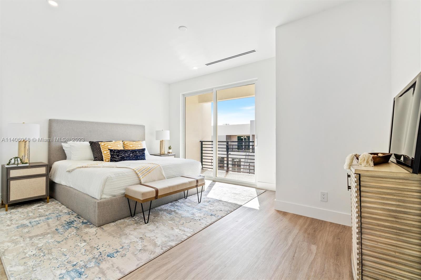 2290 Southeast 6th Street Pompano Beach, FL 33062 - Photo 15 of 22 a bedroom with a bed and wooden floor