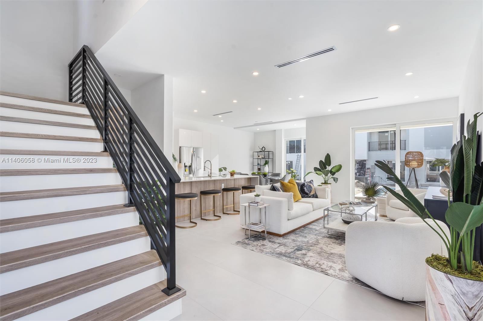 2290 Southeast 6th Street Pompano Beach, FL 33062 - Photo 2 of 22 a living room with furniture and a flat screen tv