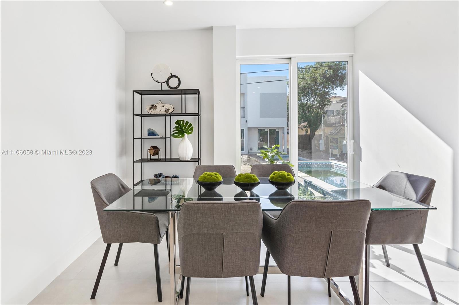2290 Southeast 6th Street Pompano Beach, FL 33062 - Photo 8 of 22 a dining room with furniture and window