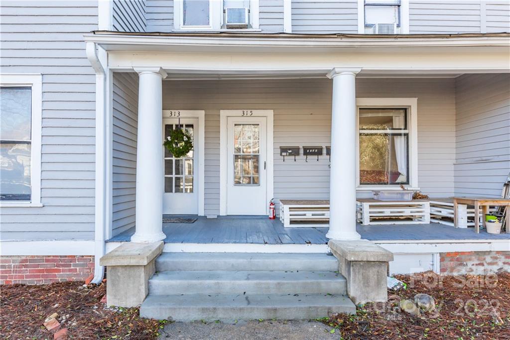 315 State Street Greensboro, NC 27403 - Photo 3 of 21 a front view of a house with outdoor seating