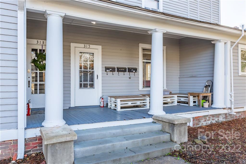 315 State Street Greensboro, NC 27403 - Photo 4 of 21 front view of a house with a bench