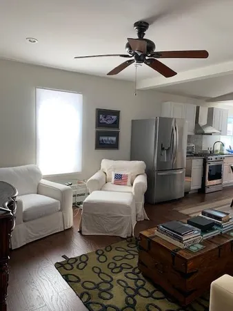a bedroom with furniture and a rug