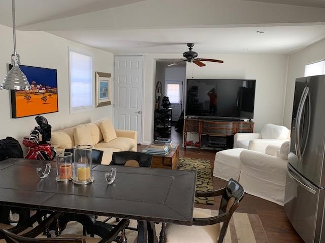 136 Sampson Place Long Branch, NJ 07740 - Photo 3 of 18 a living room with furniture a flat screen tv and kitchen view