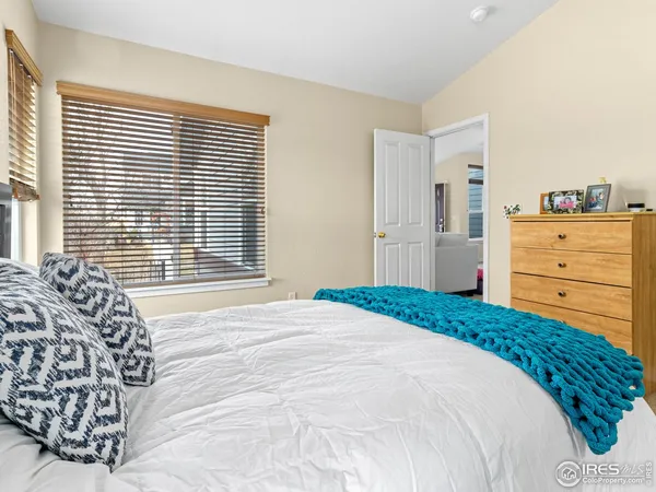 a bedroom with a bed and a table