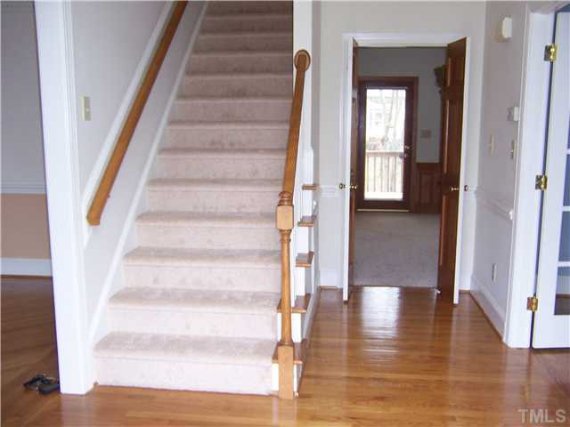 7900 Sandy Bottom Way Raleigh, NC 27613 - Photo 11 of 22 Hardwood floor foyer with study to the right, family room straight ahead and dining rm to the left. Foyer