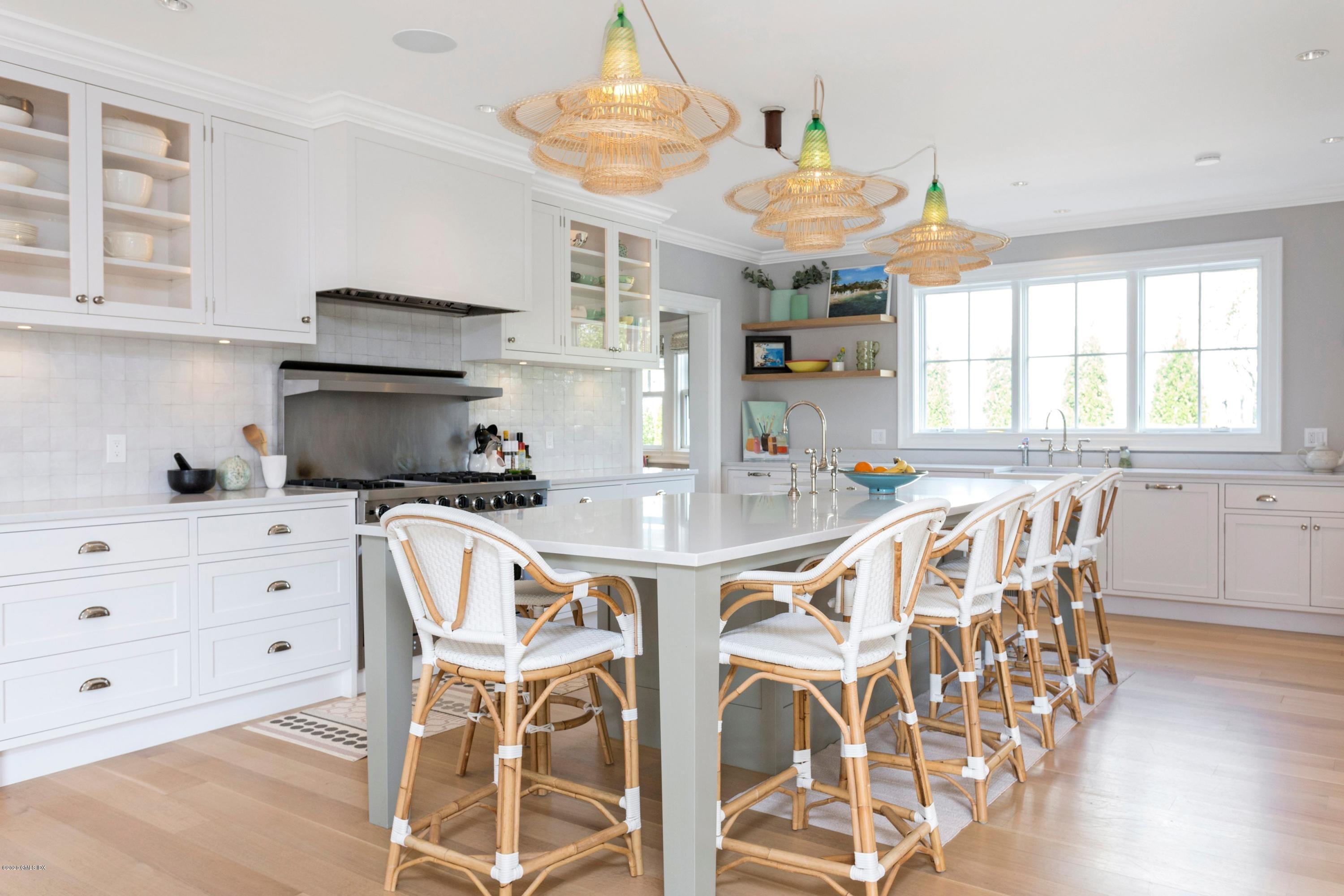 186 Shore Road Old Greenwich, CT 06870 - Photo 11 of 37 a view of a dining room with furniture window and wooden floor