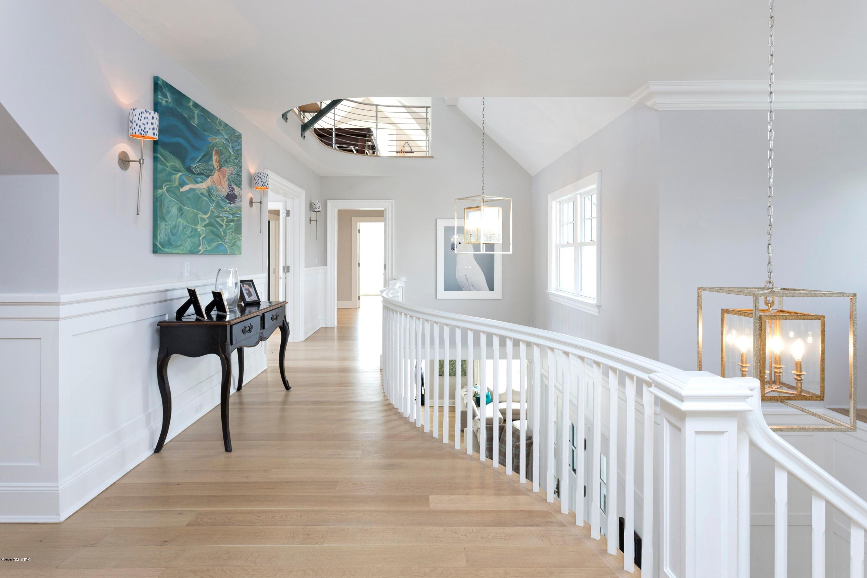 186 Shore Road Old Greenwich, CT 06870 - Photo 17 of 37 a view of a livingroom with furniture windows wooden floor and front door