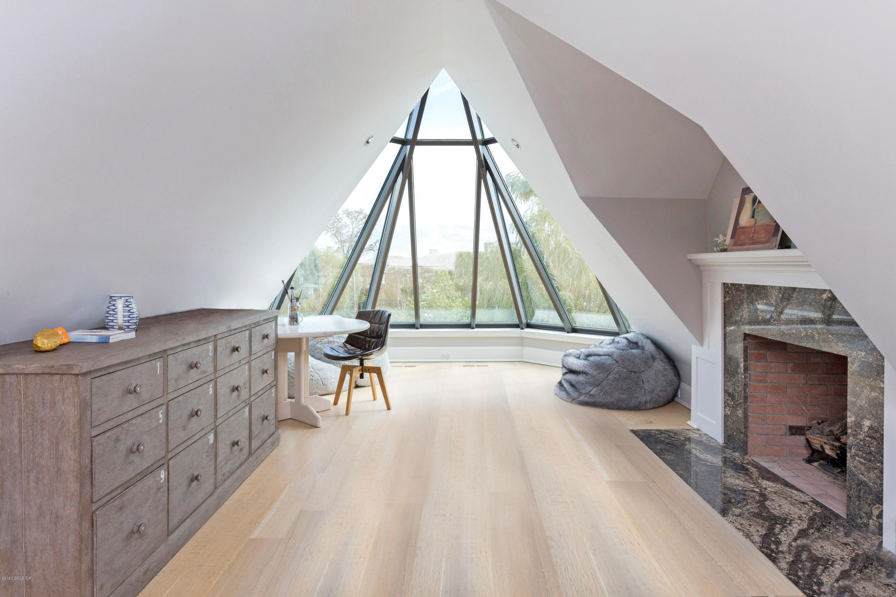 186 Shore Road Old Greenwich, CT 06870 - Photo 30 of 37 a living room with furniture and a fireplace