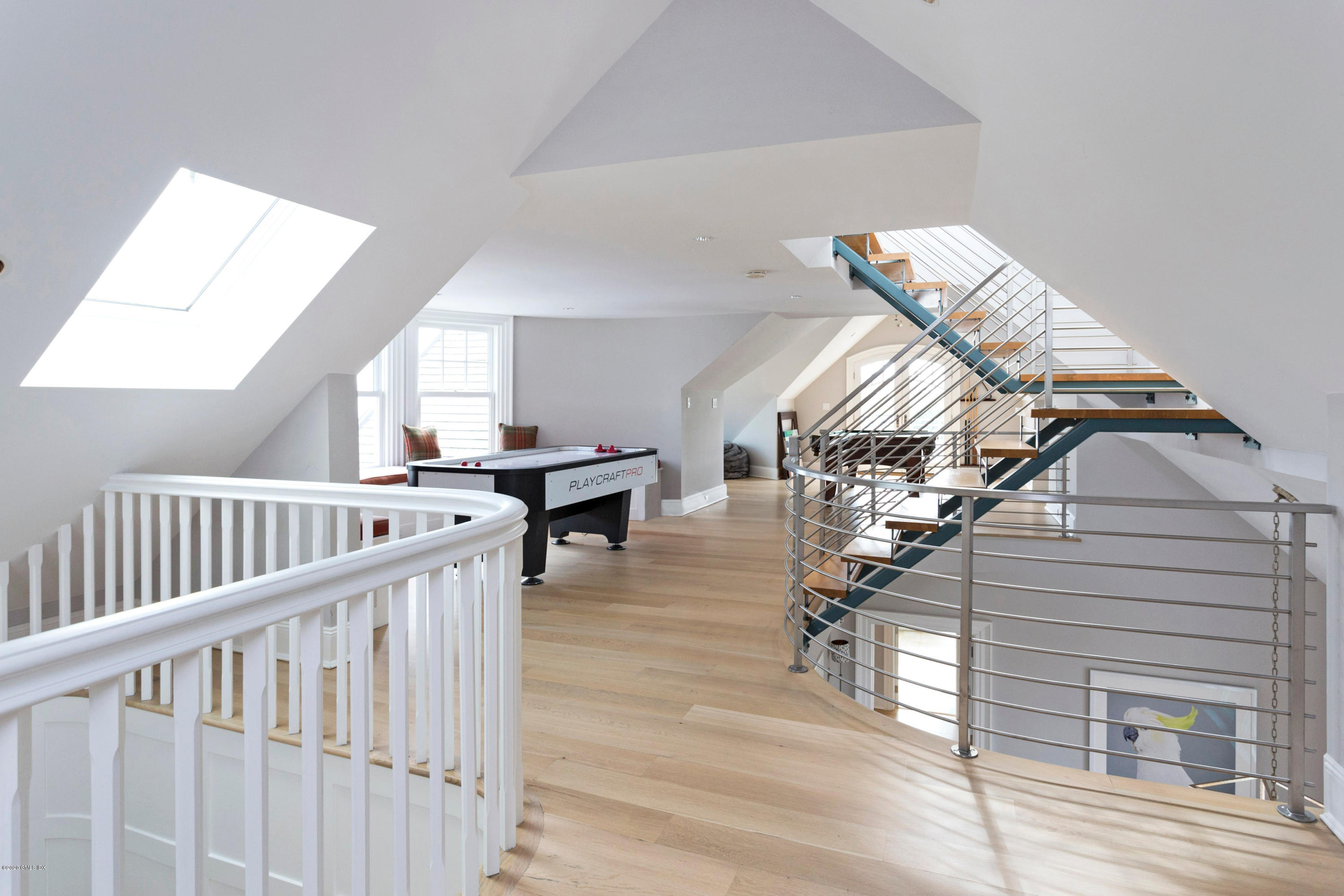 186 Shore Road Old Greenwich, CT 06870 - Photo 31 of 37 a view of entryway livingroom and hall with wooden floor