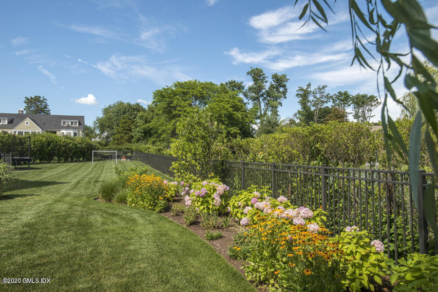 186 Shore Road Old Greenwich, CT 06870 - Photo 36 of 37 a view of a lake with a yard