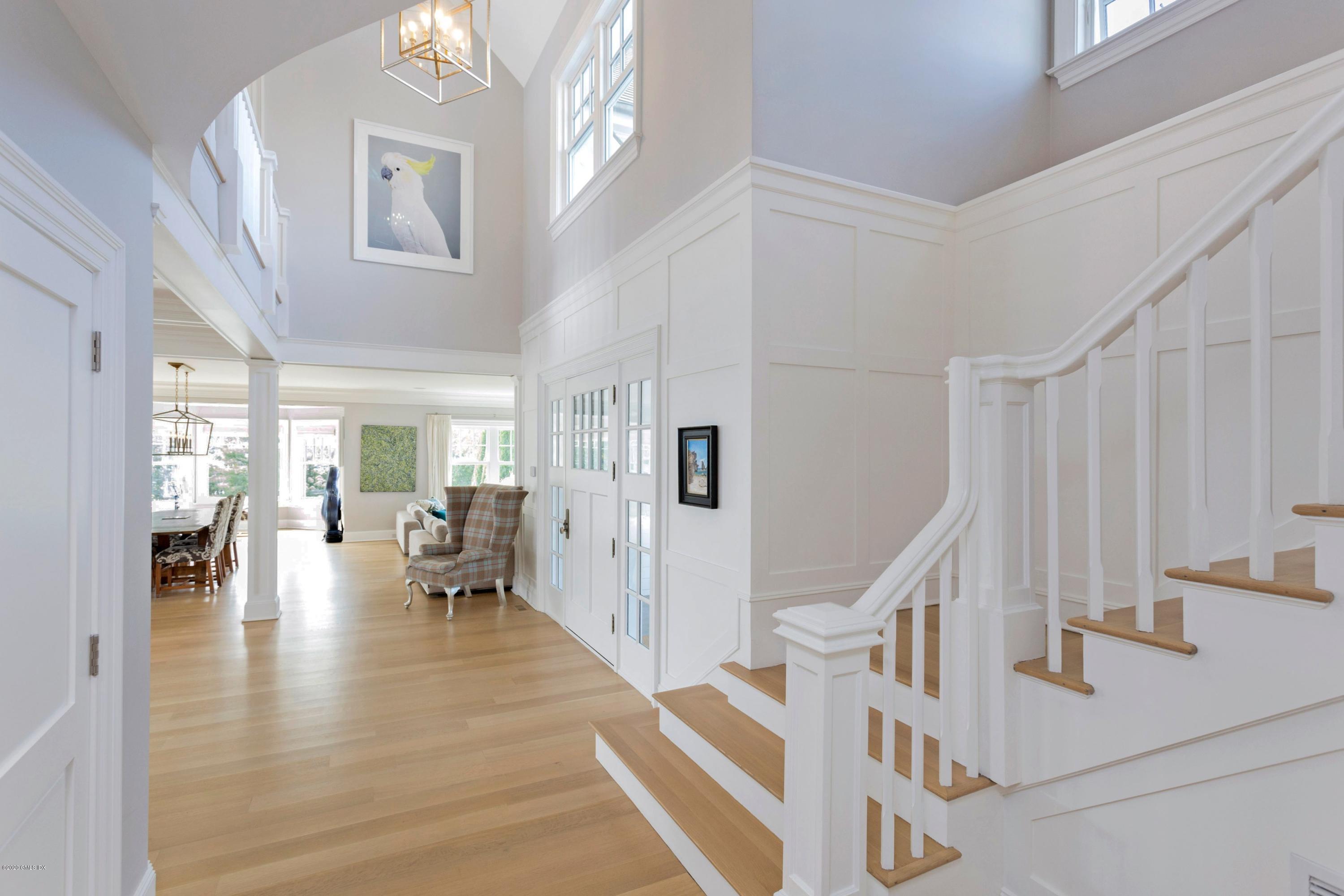 186 Shore Road Old Greenwich, CT 06870 - Photo 4 of 37 a view of dining room with furniture wooden floor and windows