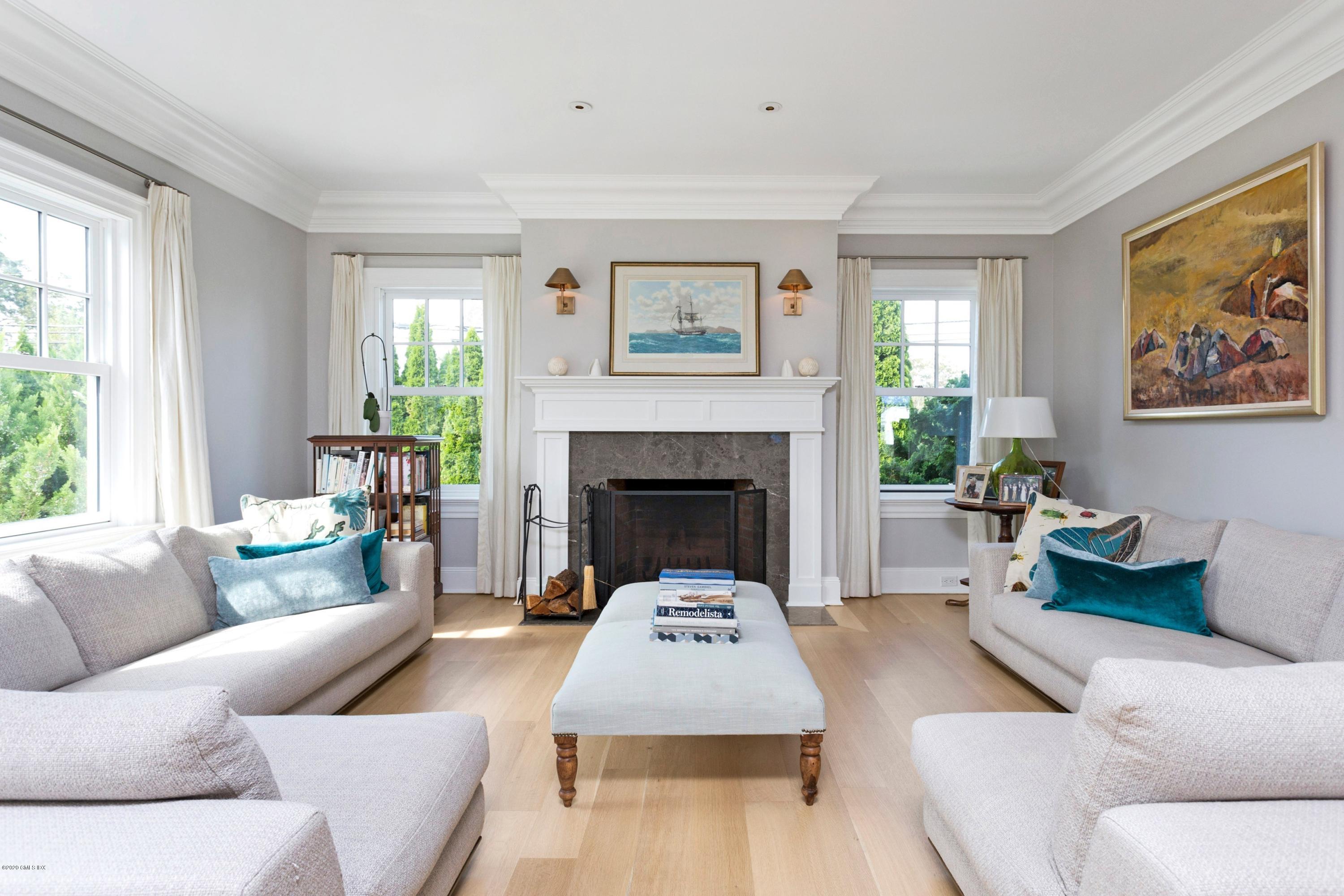 186 Shore Road Old Greenwich, CT 06870 - Photo 7 of 37 a living room with furniture and a fireplace