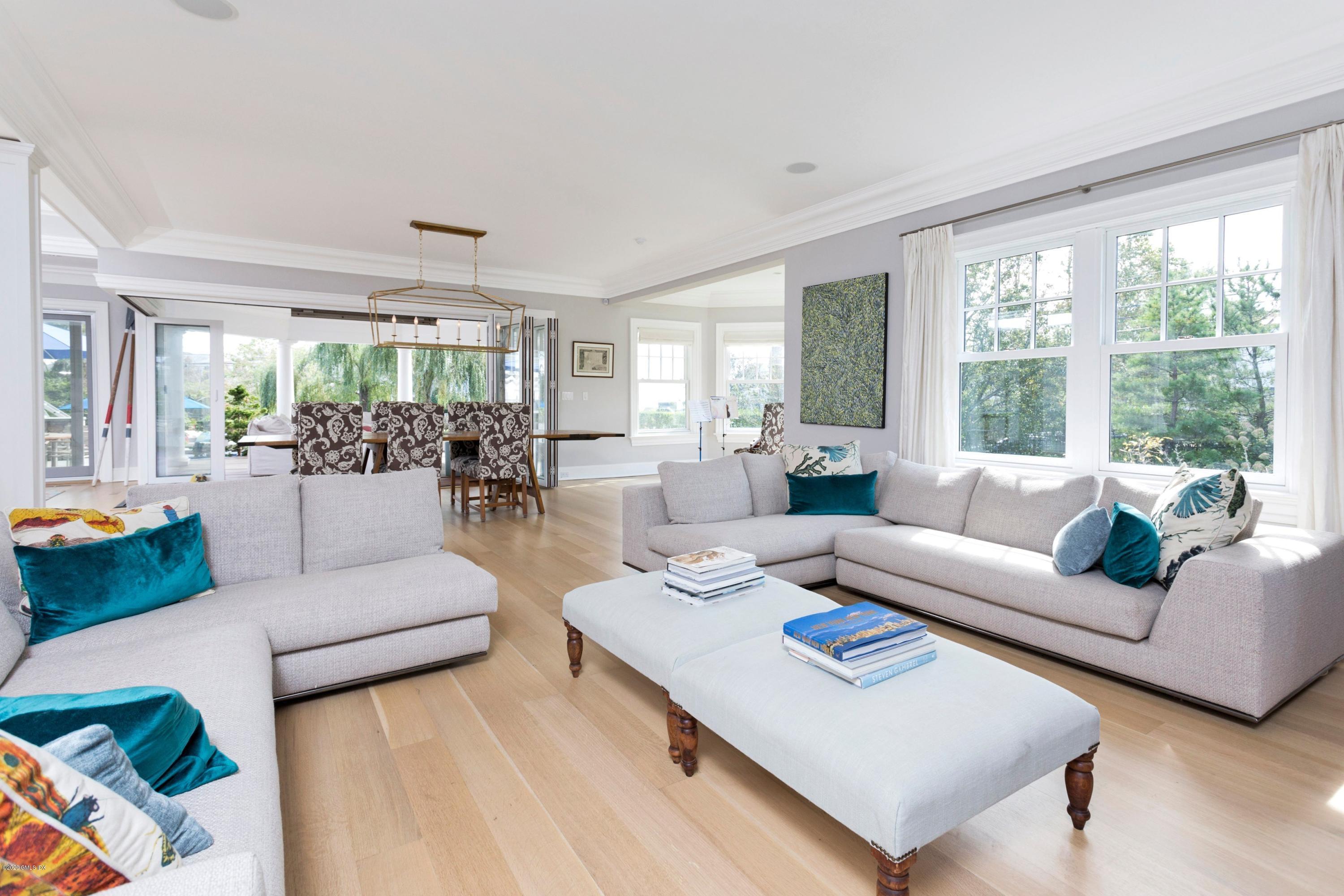 186 Shore Road Old Greenwich, CT 06870 - Photo 8 of 37 a living room with furniture and a large window