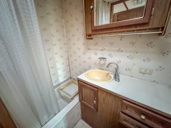 a bathroom with a sink and a mirror