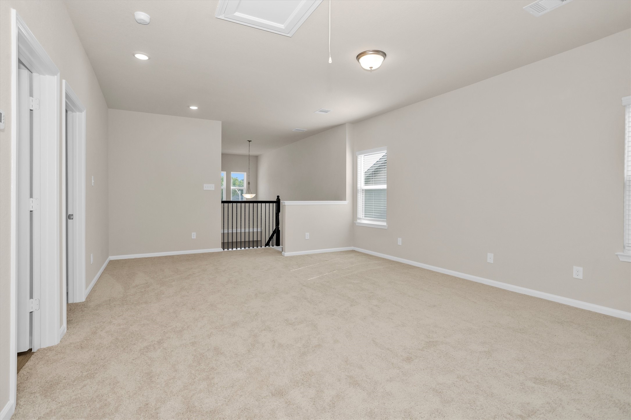 9749 Enclave Ridge Road Willis, TX 77318 - Photo 17 of 29 Massive game room/loft offering flexible living space.