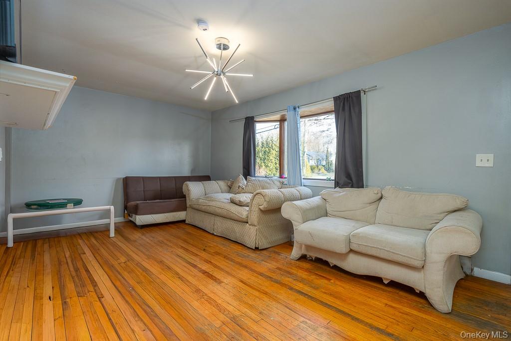 19 James Road Monroe, NY 10950 - Photo 15 of 22 a living room with furniture and a wooden floor