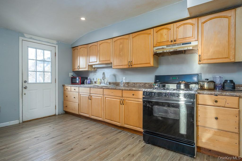 19 James Road Monroe, NY 10950 - Photo 17 of 22 a kitchen with stainless steel appliances granite countertop a stove a sink and white cabinets