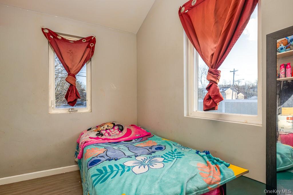 19 James Road Monroe, NY 10950 - Photo 20 of 22 a bedroom with a bed and a painting on the wall