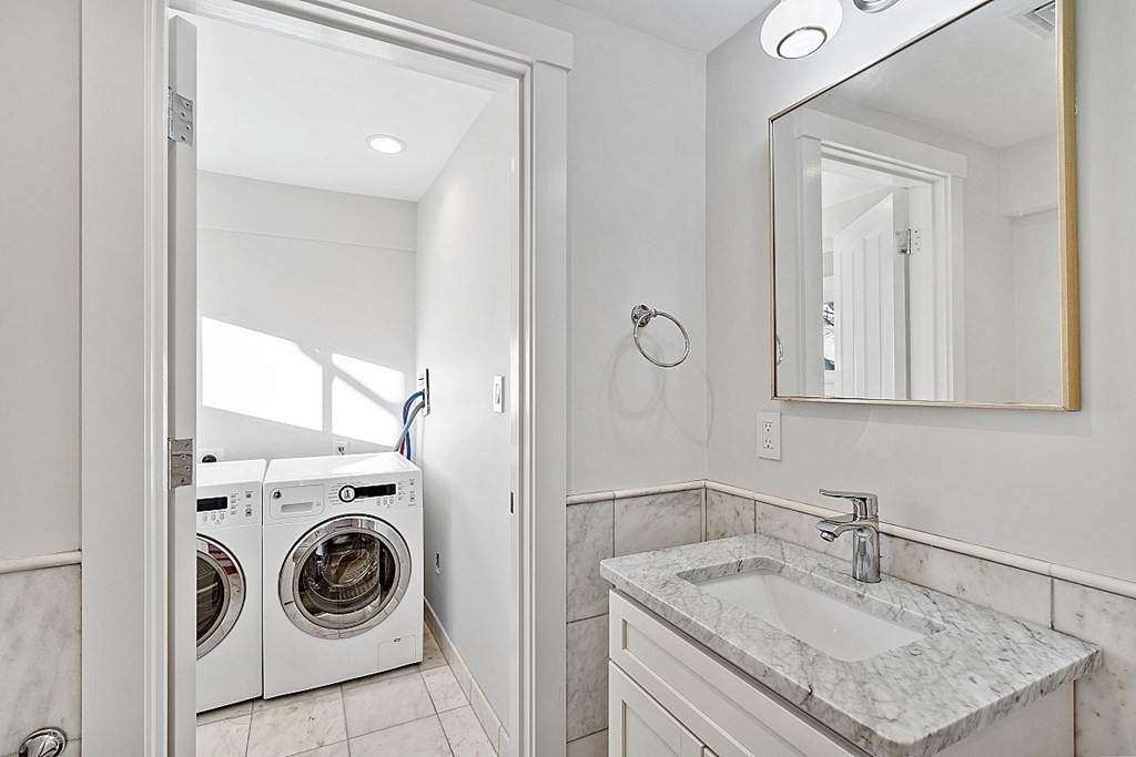 29 Central Street, Unit 2 Manchester, MA 01944 - Photo 20 of 22 a bathroom with a sink and a mirror