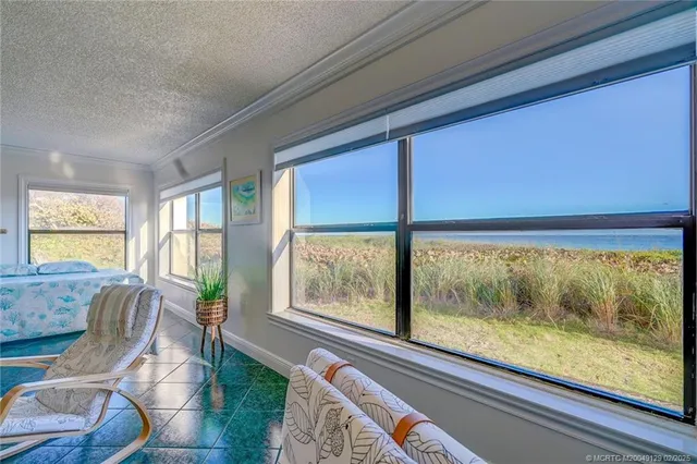a living room with large windows