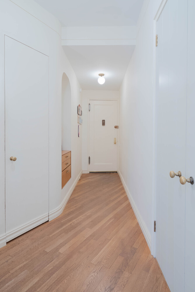 210 West 19th Street, Unit 6D Manhattan, NY 10011 - Photo 10 of 12 wooden floor in an empty room