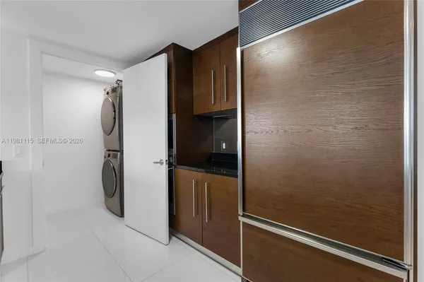 a bathroom with a shower and a glass door