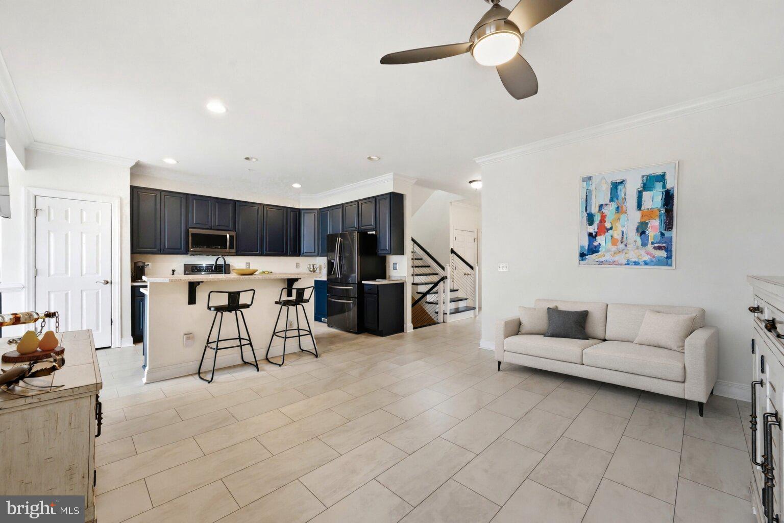 202 Muir Street, Unit 202 Cambridge, MD 21613 - Photo 15 of 54 a living room with furniture and kitchen view