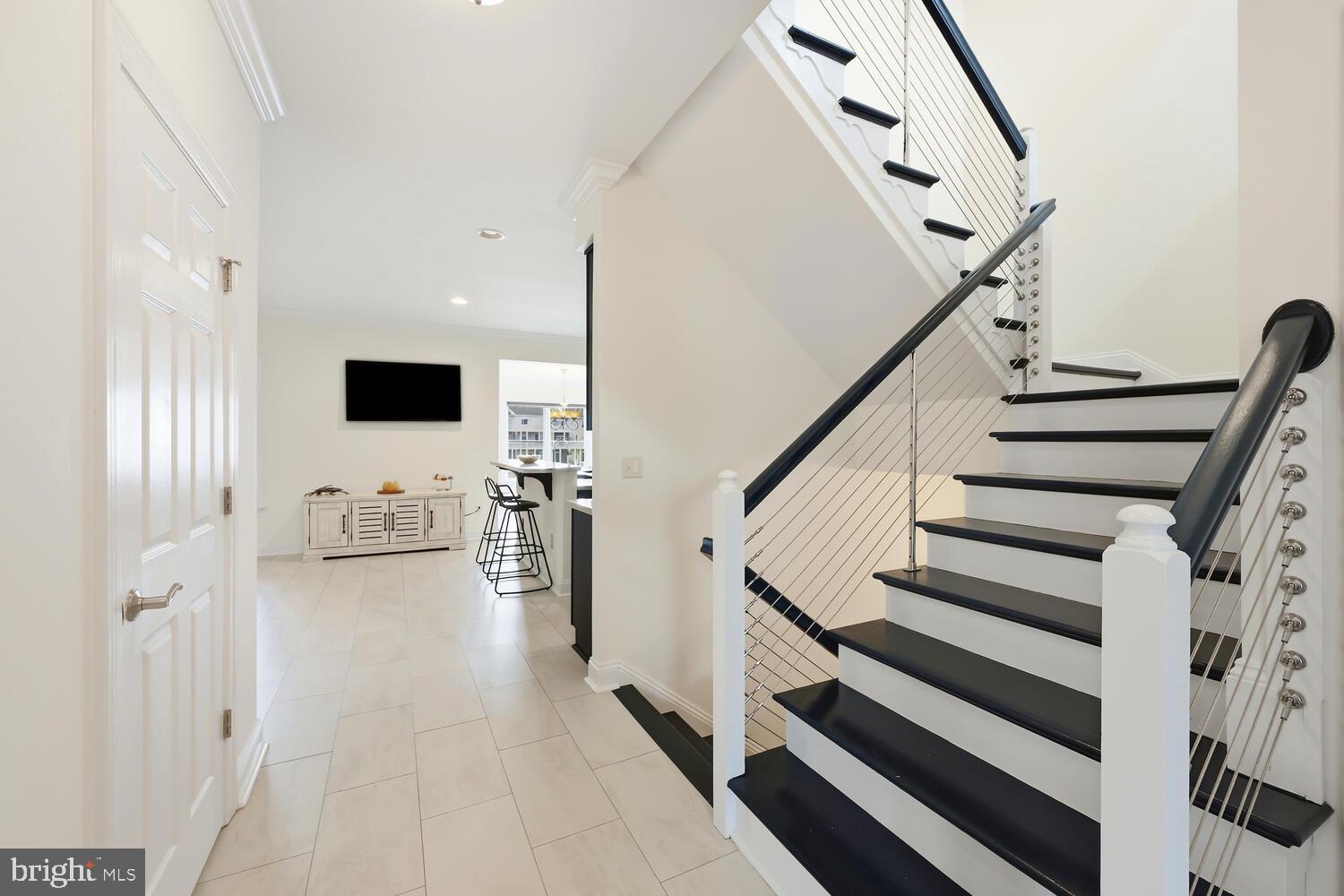 202 Muir Street, Unit 202 Cambridge, MD 21613 - Photo 22 of 54 a view of entryway and hall with wooden floor