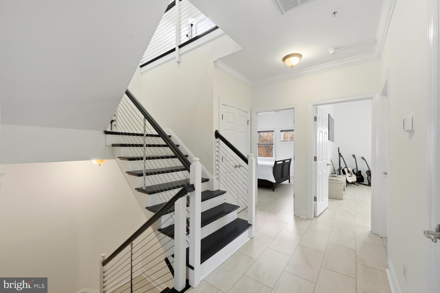 202 Muir Street, Unit 202 Cambridge, MD 21613 - Photo 23 of 54 a view of entryway and hall with wooden floor