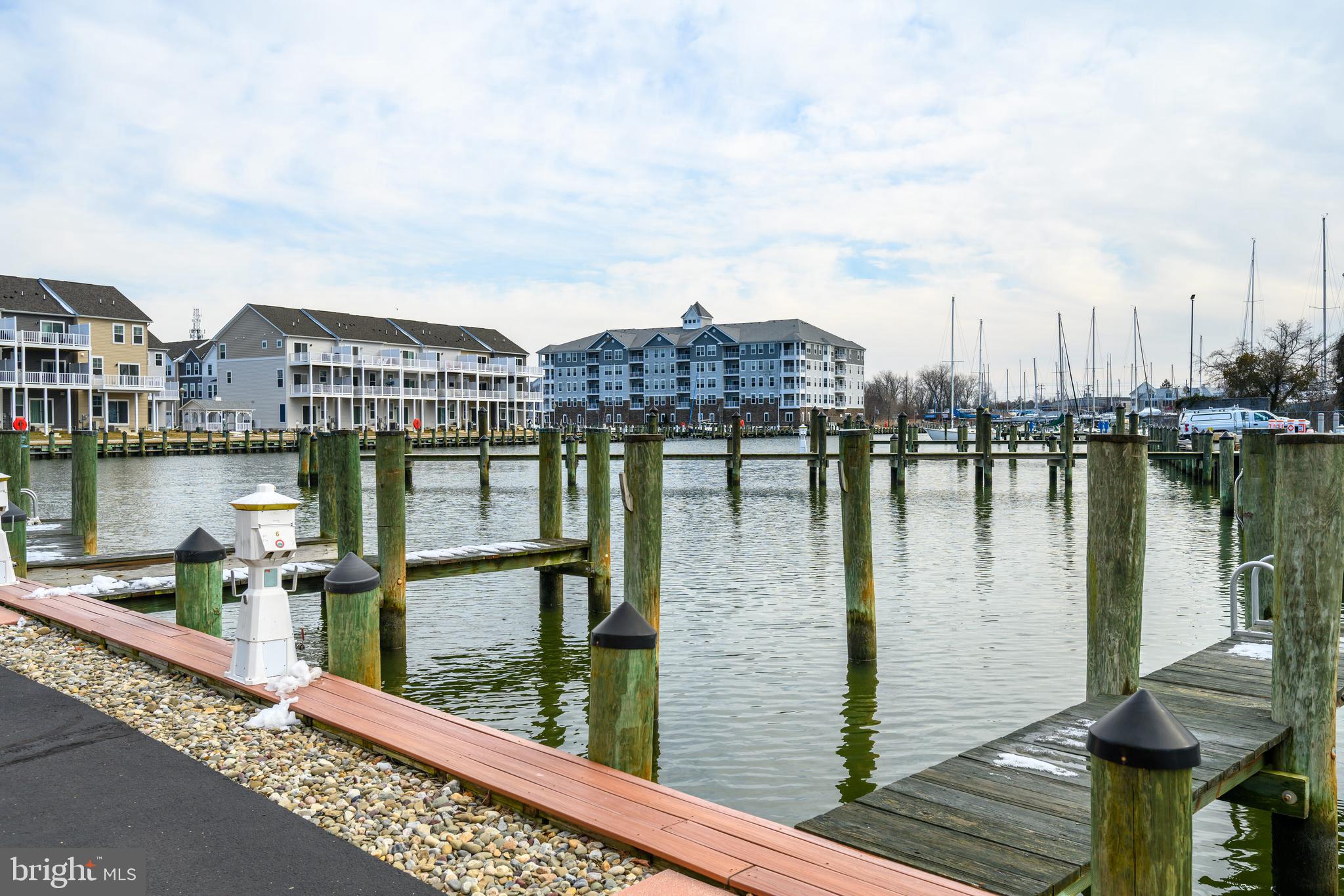 202 Muir Street, Unit 202 Cambridge, MD 21613 - Photo 3 of 54 a view of a lake with a terrace
