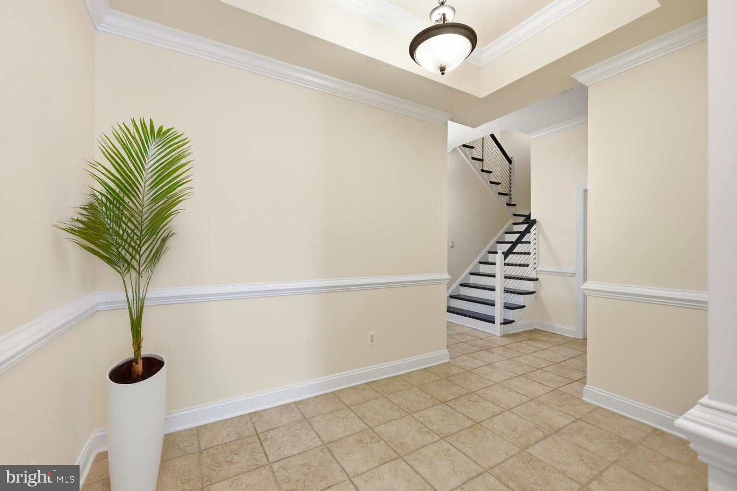 202 Muir Street, Unit 202 Cambridge, MD 21613 - Photo 39 of 54 a view of entryway with wooden floor