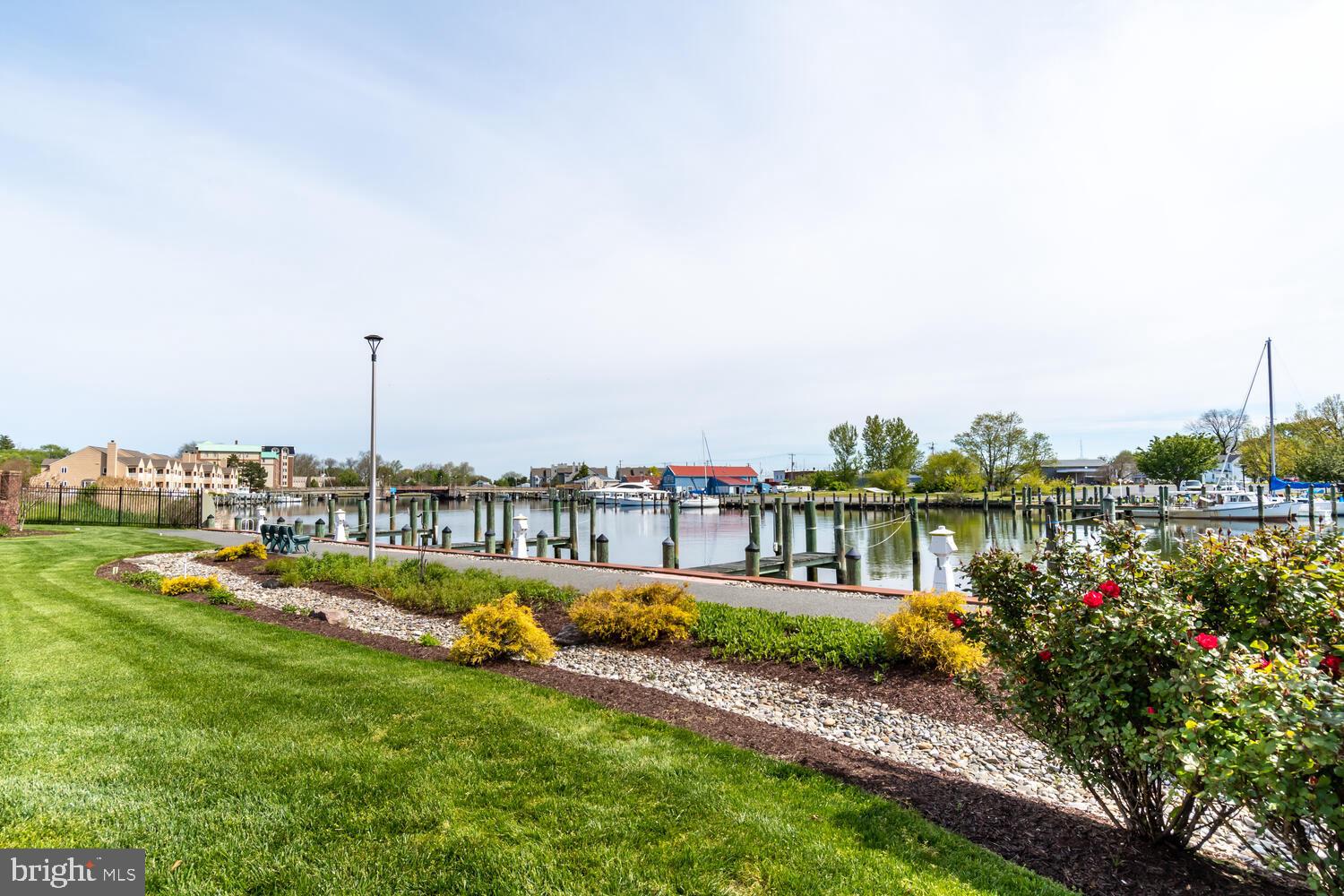 202 Muir Street, Unit 202 Cambridge, MD 21613 - Photo 45 of 54 a view of a lake with houses with outdoor space