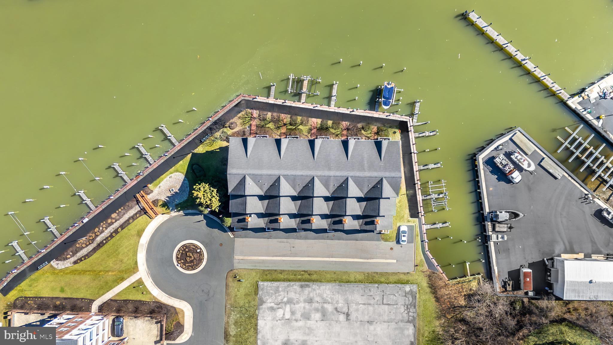 202 Muir Street, Unit 202 Cambridge, MD 21613 - Photo 49 of 54 a utility room with dryer and washer
