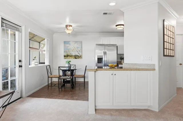 a view of a livingroom with furniture and a window