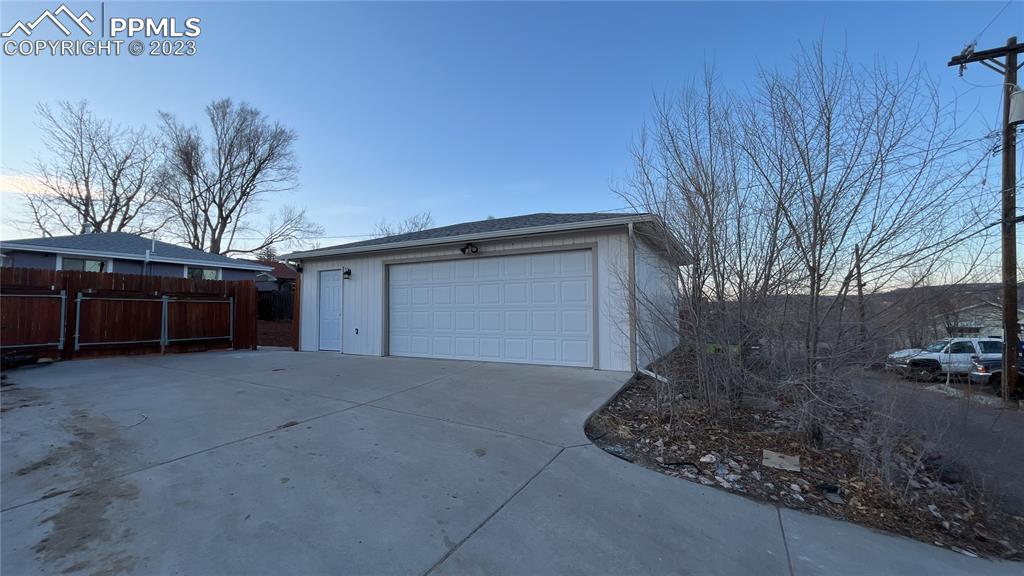 1219 Prairie Road Colorado Springs, CO 80909 - Photo 16 of 16 a view of a house with a outdoor space