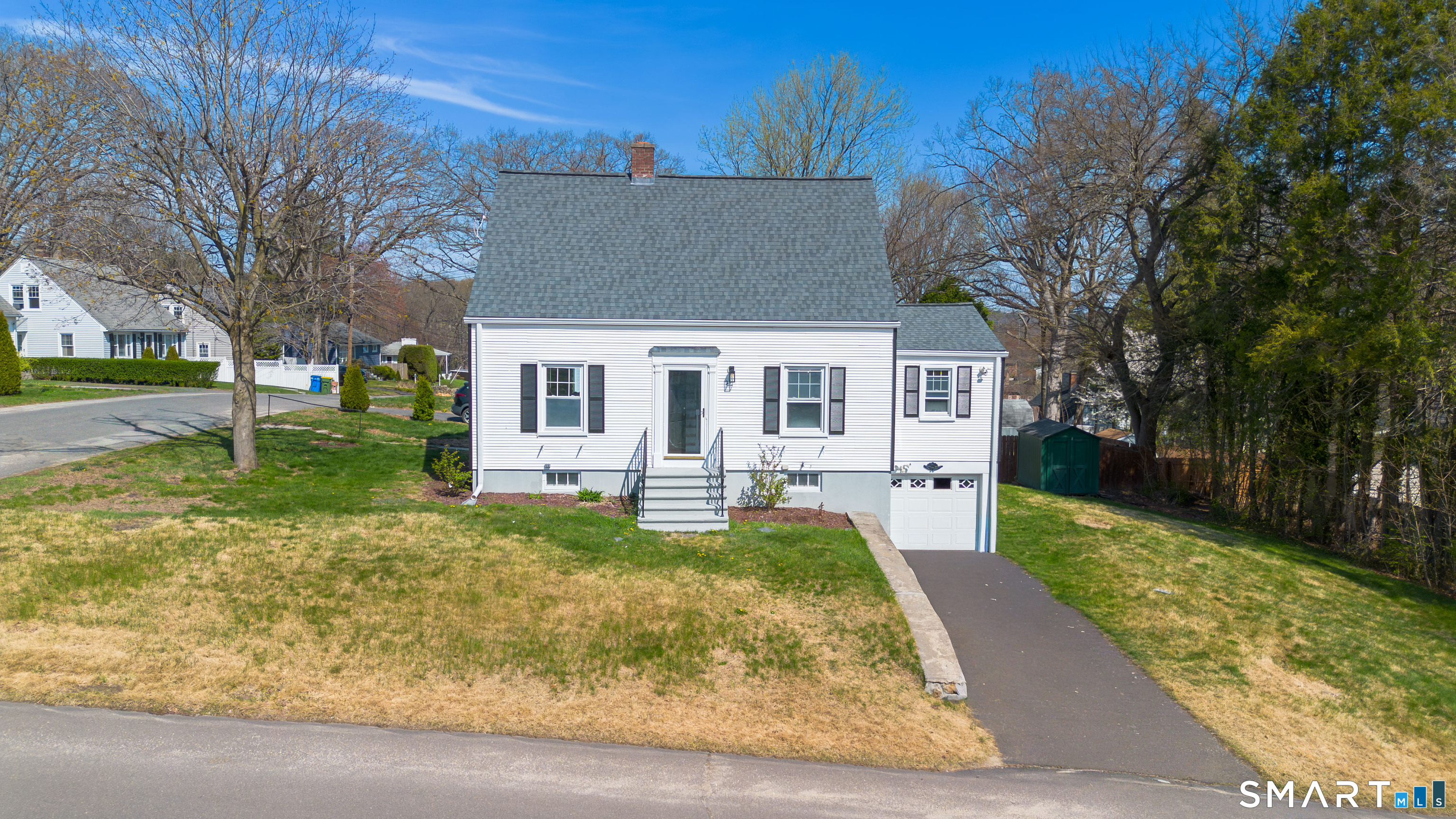 27 Glendale Drive Waterbury, CT 06708 - Photo 1 of 27 a view of a house with a yard patio and fire pit