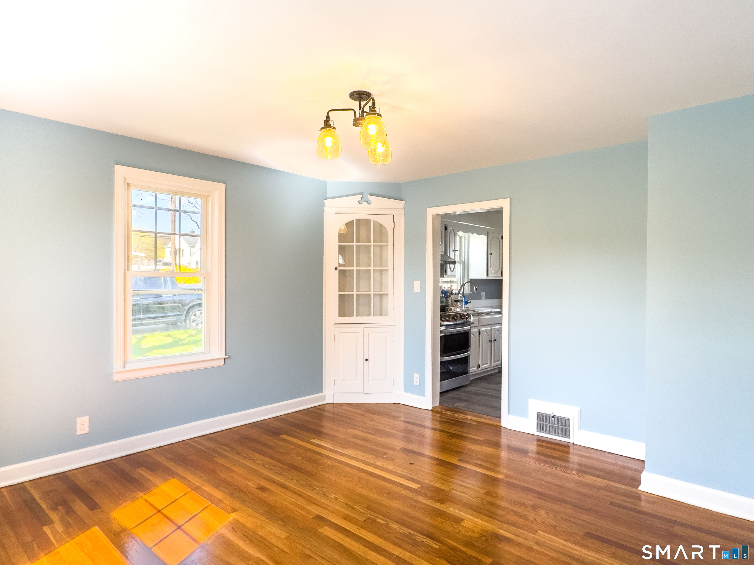 27 Glendale Drive Waterbury, CT 06708 - Photo 12 of 27 a view of an empty room with wooden floor and a window