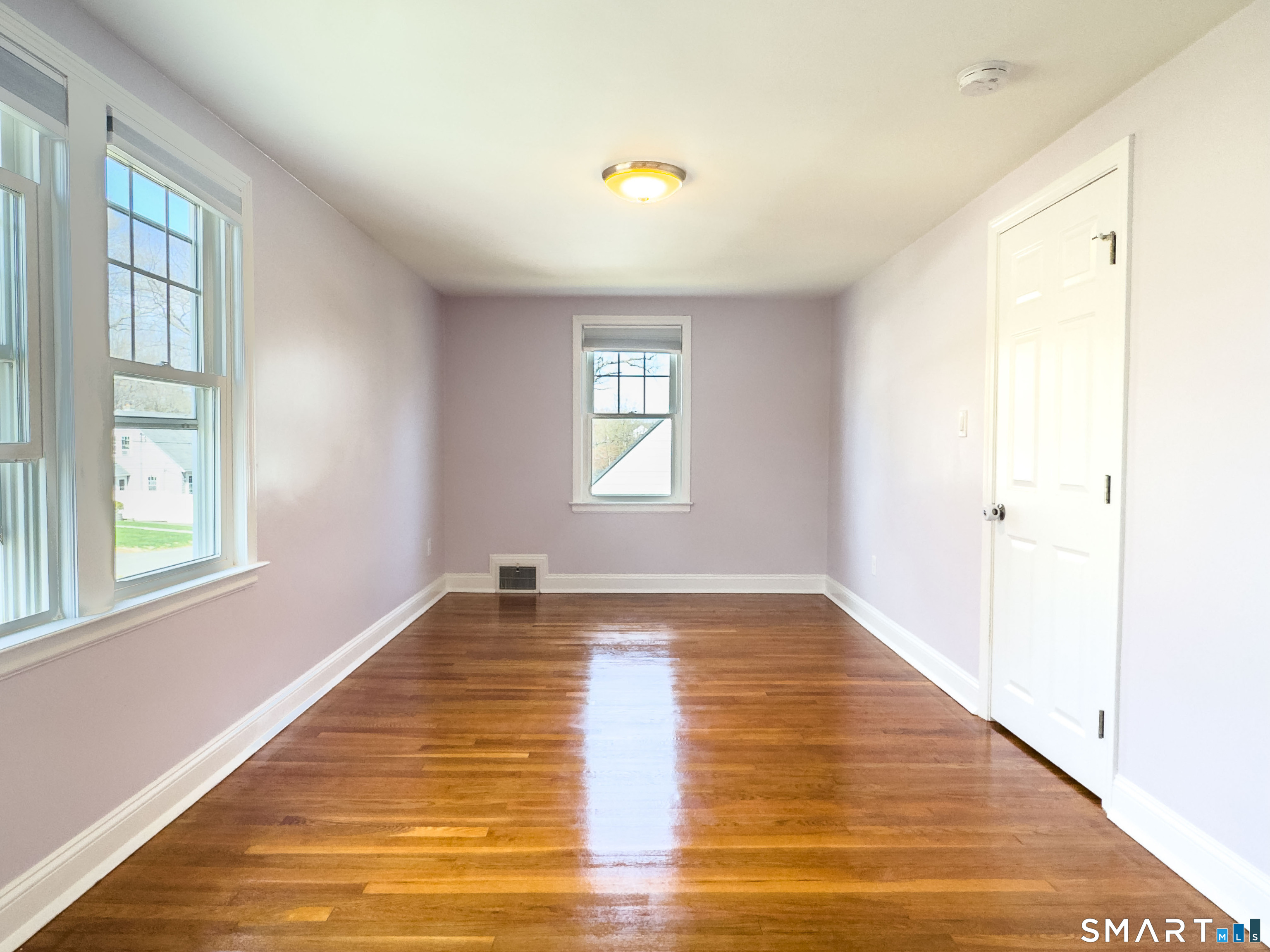 27 Glendale Drive Waterbury, CT 06708 - Photo 13 of 27 a view of an empty room with wooden floor and a window