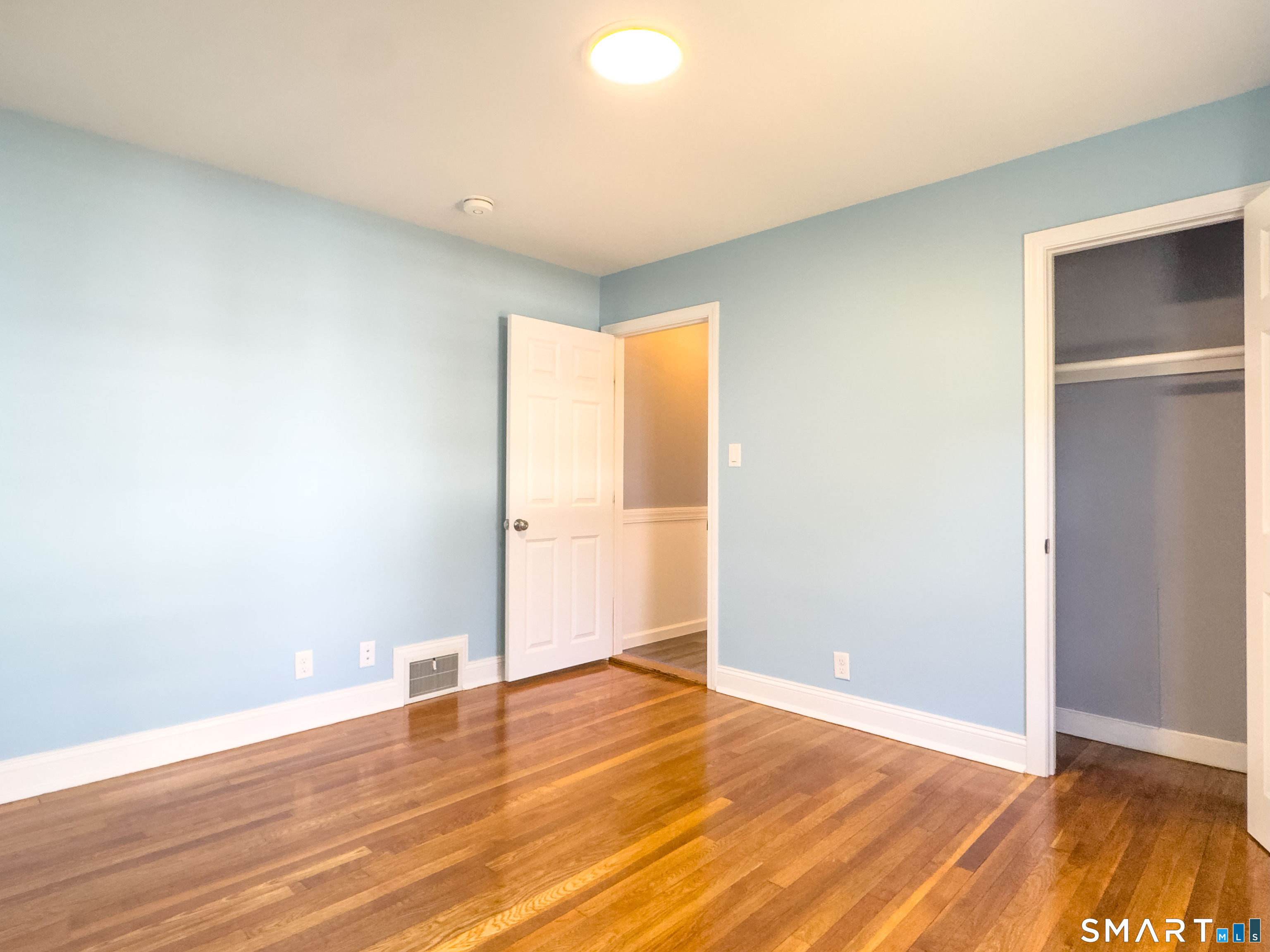 27 Glendale Drive Waterbury, CT 06708 - Photo 15 of 27 an empty room with wooden floor and windows