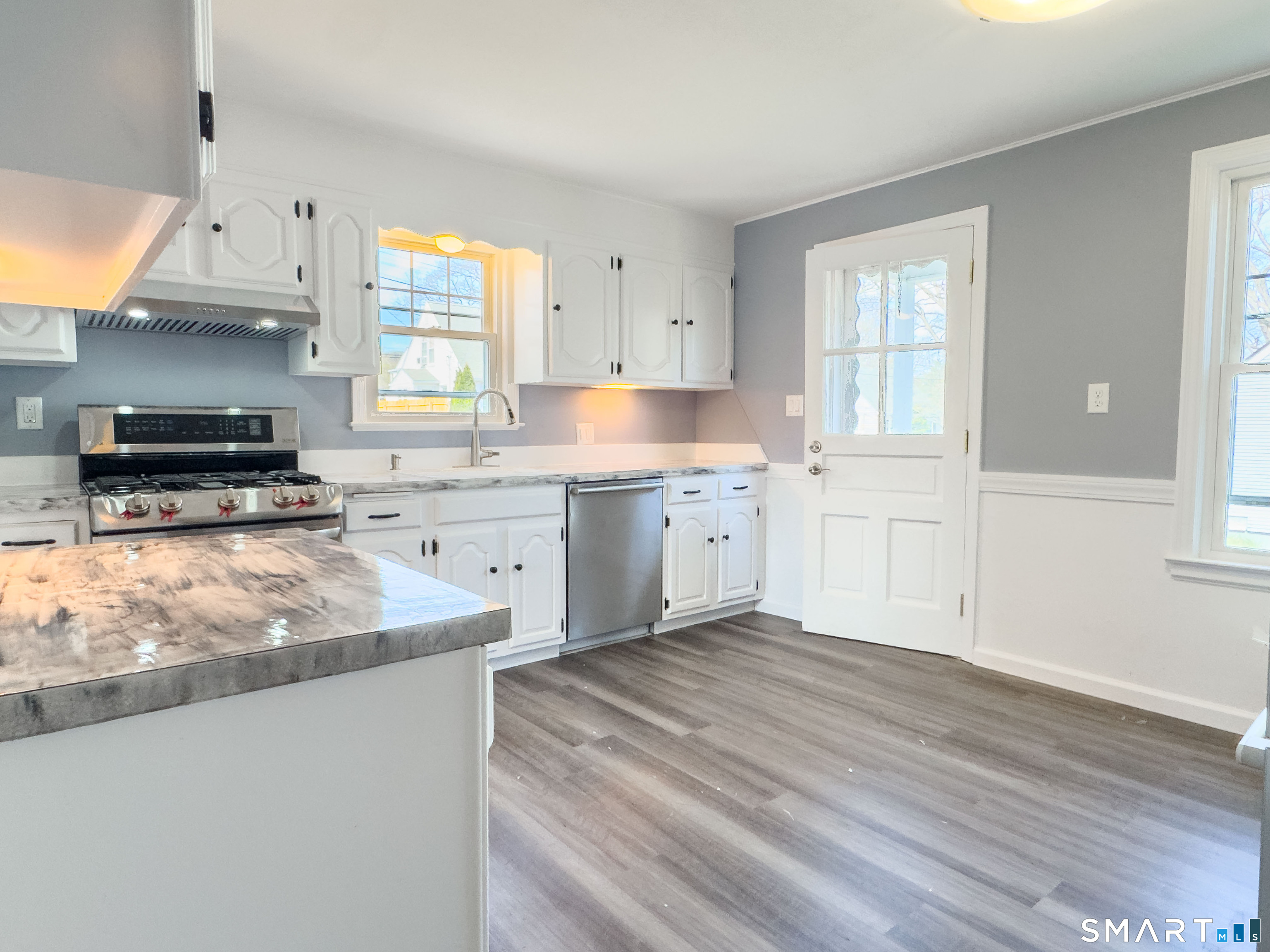 27 Glendale Drive Waterbury, CT 06708 - Photo 5 of 27 a kitchen with stainless steel appliances granite countertop a stove a sink and a microwave